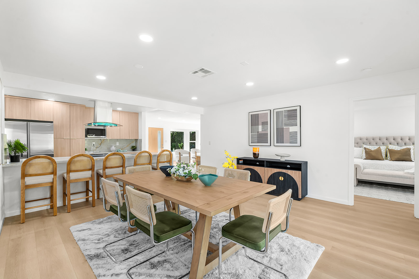 Open dining and kitchen great room sightline to primary suite