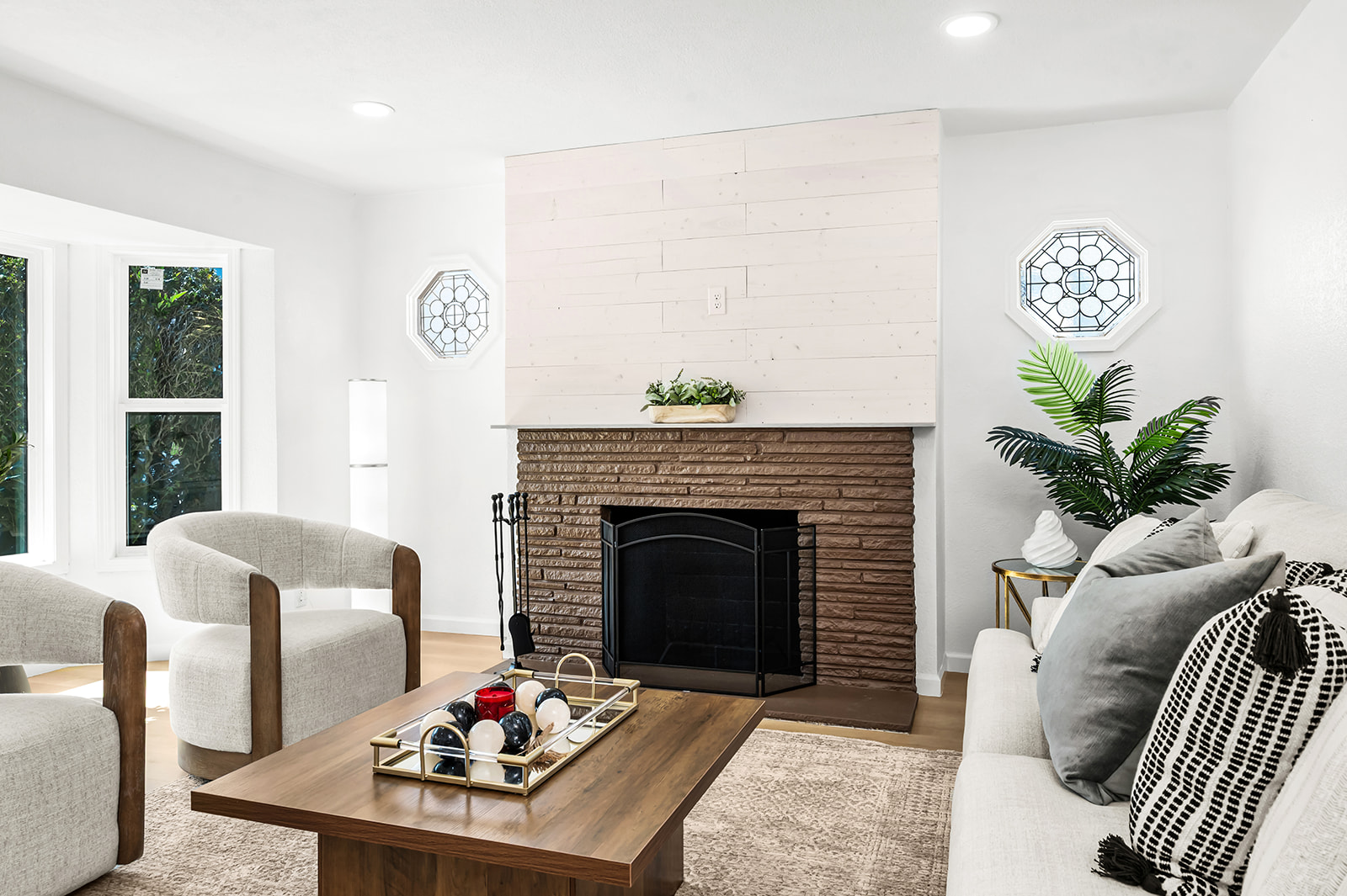 Twin octagonal stained-glass windows flanking the fireplace